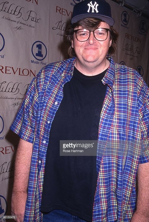 92150472-film-director-michael-moore-wearing-a-new-gettyimages[1].jpg
