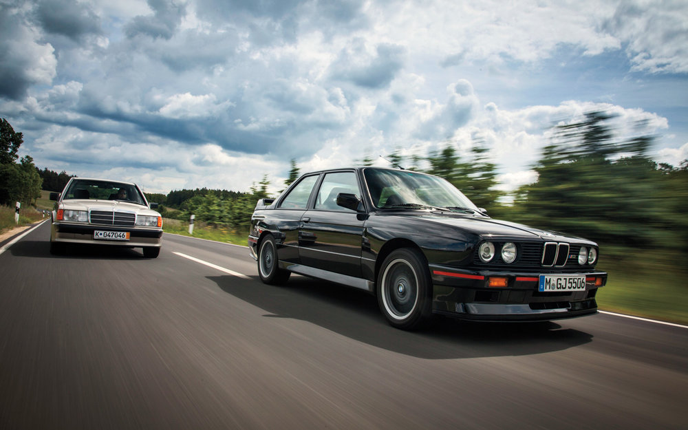 Mercedes-Benz-190E-2-3-16-BMW-M3-front-three-quarters-in-motion-2.jpg