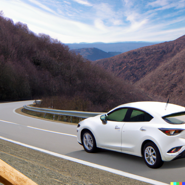 DALL·E 2023-02-07 11.05.36 - A white Mazda 3 driving on mountain road.png